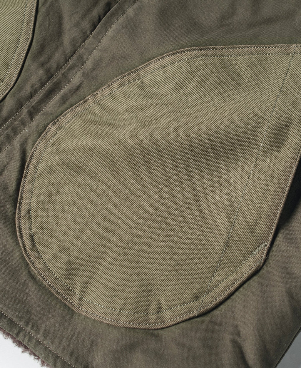 Gilet zippé doublé polaire olive avec grandes poches avant