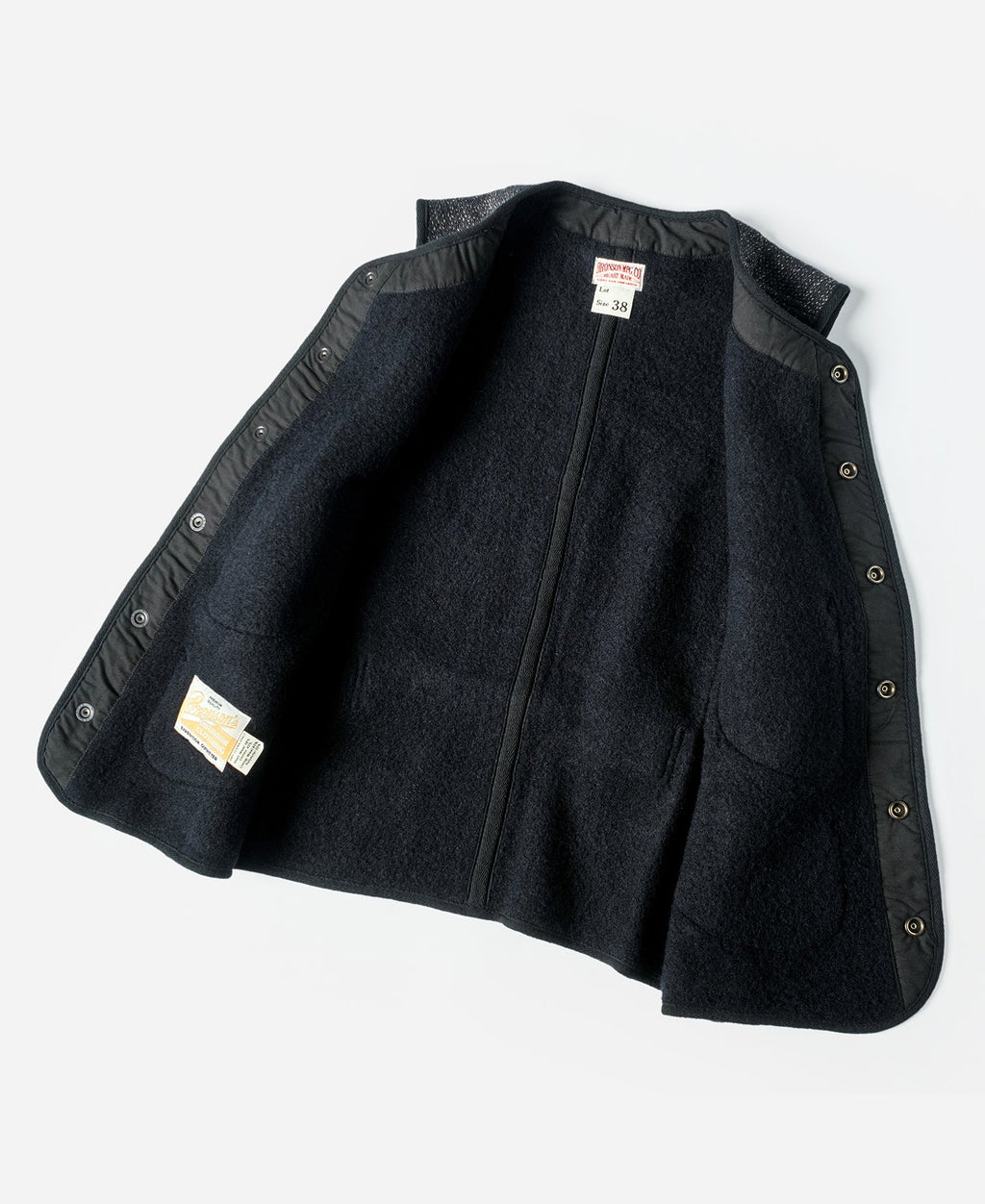 Gilet en laine mélangée poivre et sel à quatre poches avec liseré noir coupe classique