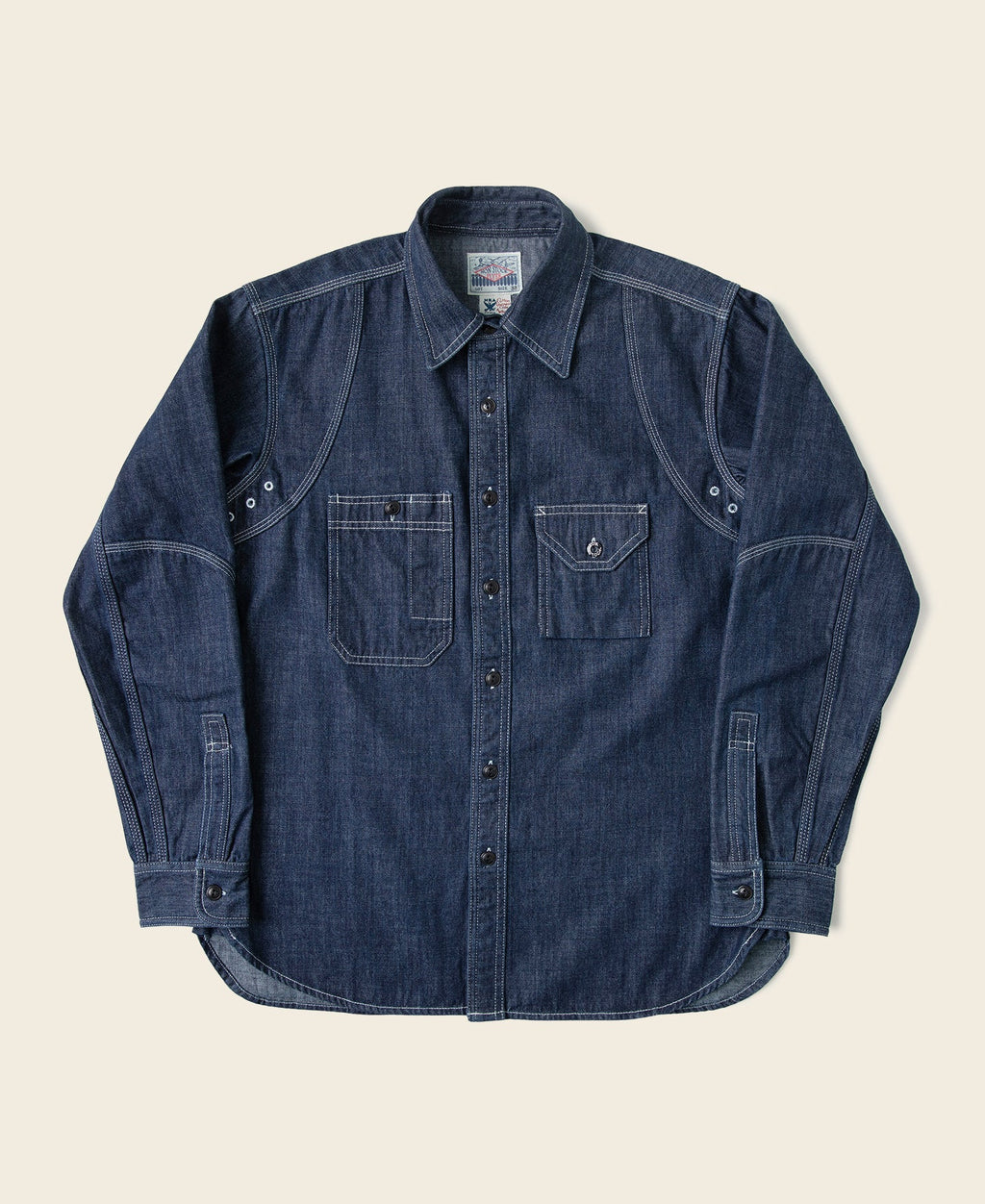 Chemise de travail Indigo en jean à manches longues, poches poitrine et boutonnage.