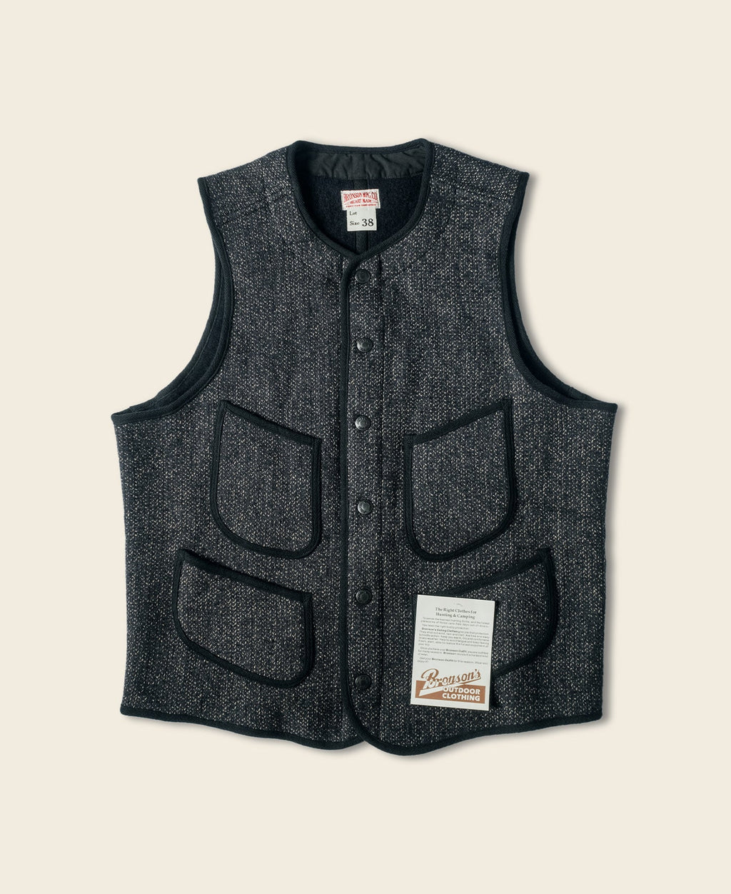 Gilet en laine mélangée poivre et sel à quatre poches avec liseré noir coupe classique