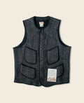 Gilet en laine mélangée poivre et sel à quatre poches avec liseré noir coupe classique