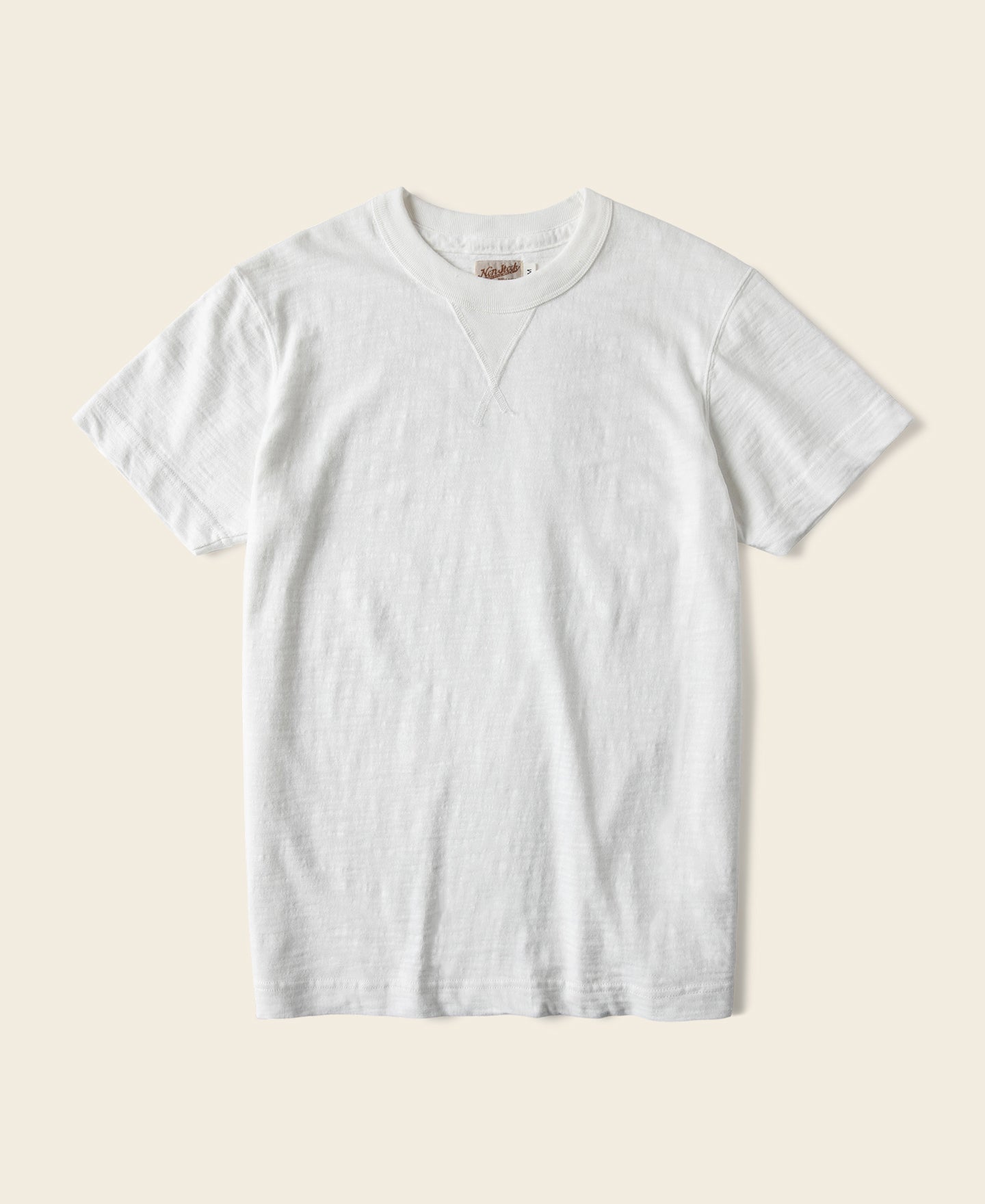 T-shirt blanc à col rond et manches courtes, avec soufflet tubulaire épais