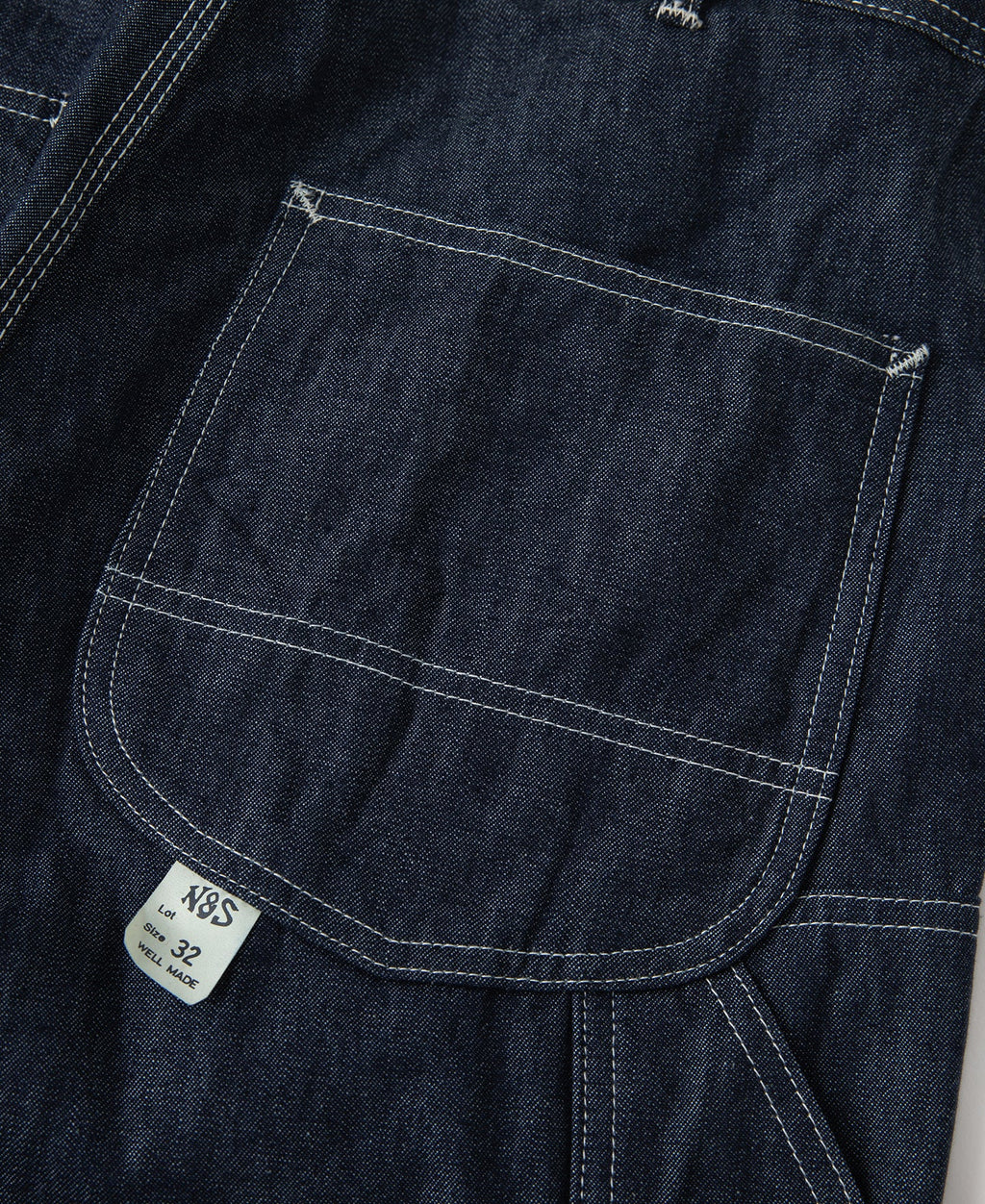 Jean toile indigo coupe large style peintre avec surpiqûres contrastantes