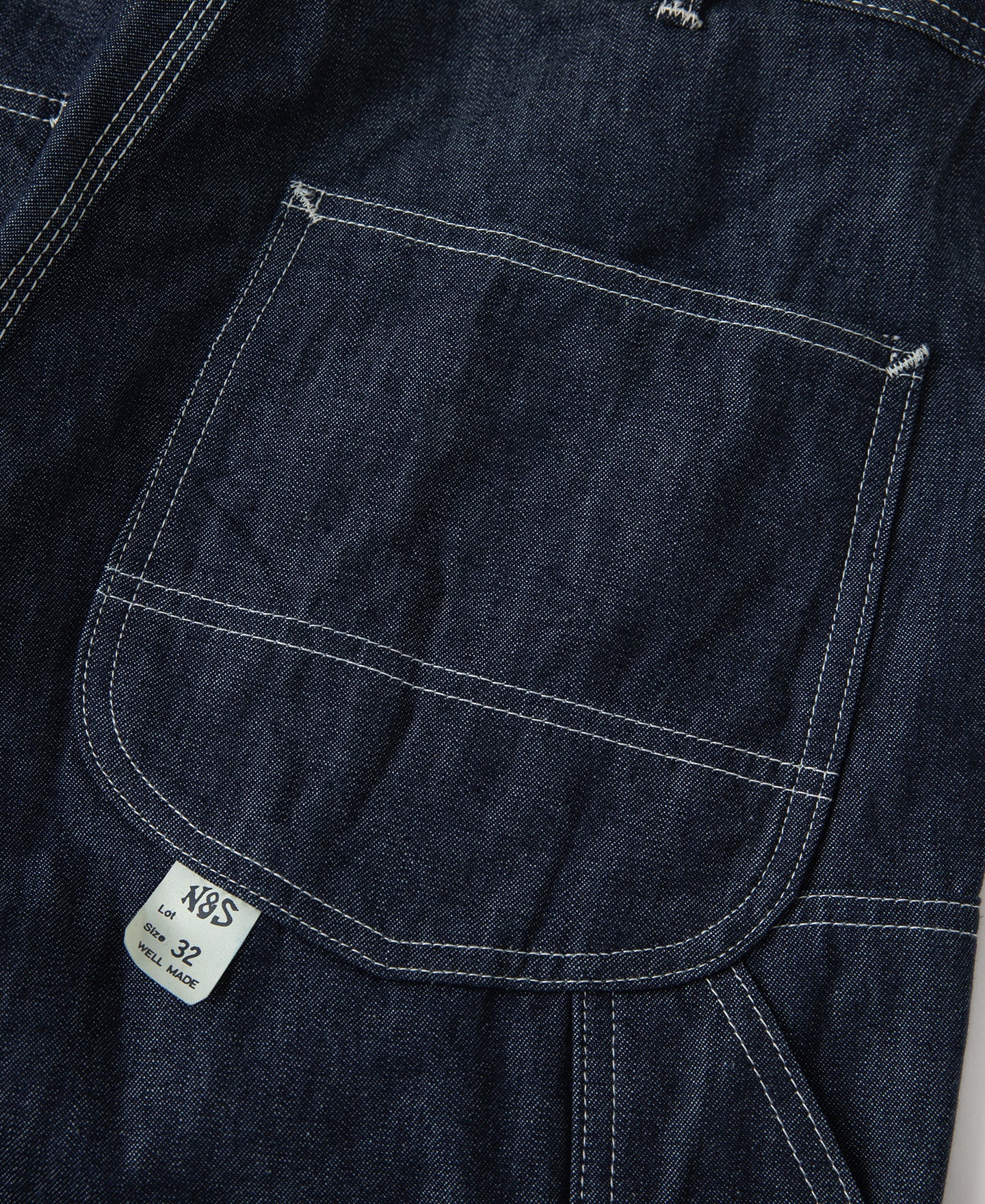 Jean toile indigo coupe large style peintre avec surpiqûres contrastantes