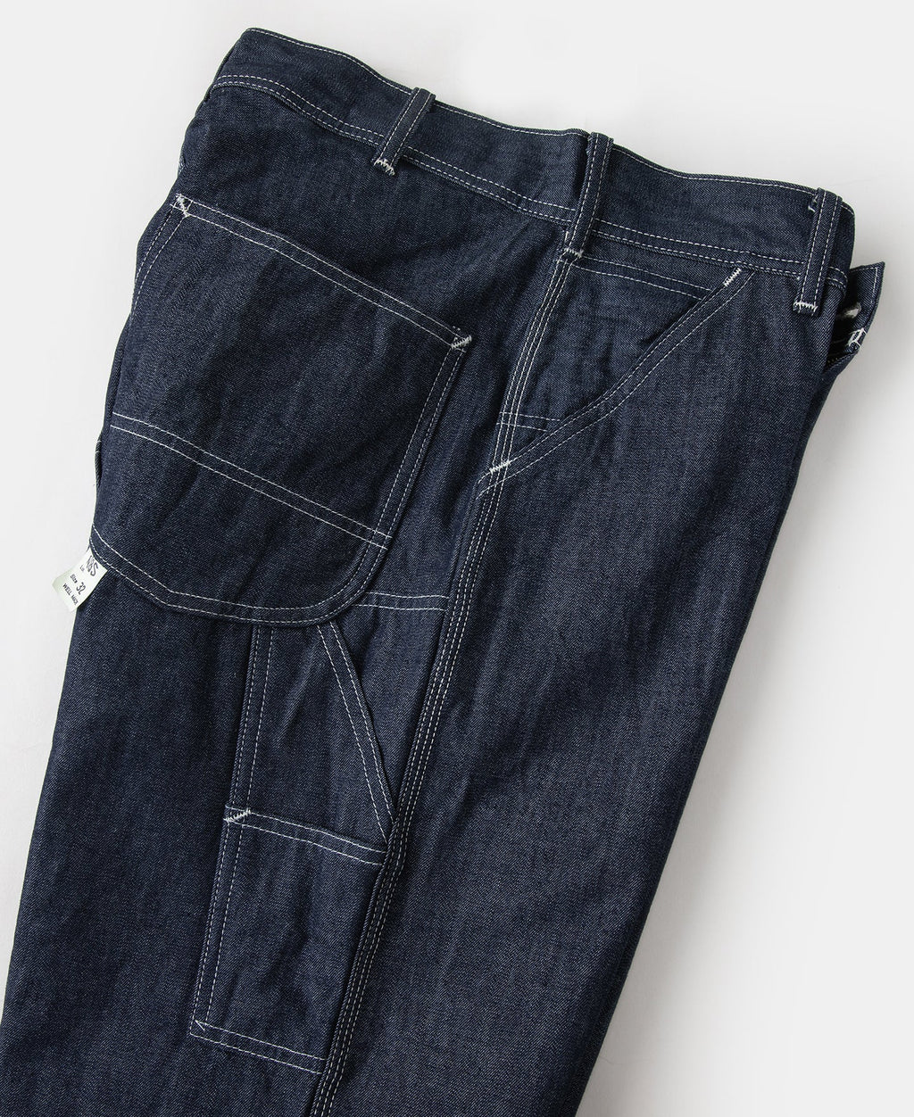 Jean toile indigo coupe large style peintre avec surpiqûres contrastantes