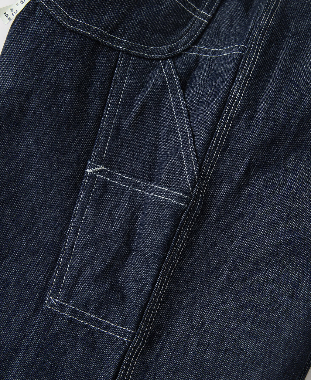 Jean toile indigo coupe large style peintre avec surpiqûres contrastantes