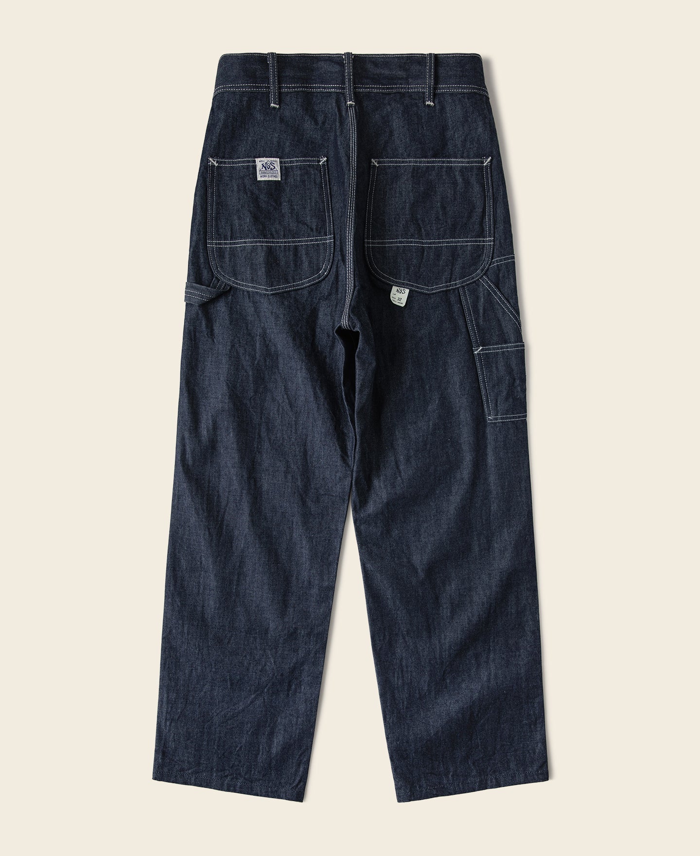 Jean toile indigo coupe large style peintre avec surpiqûres contrastantes