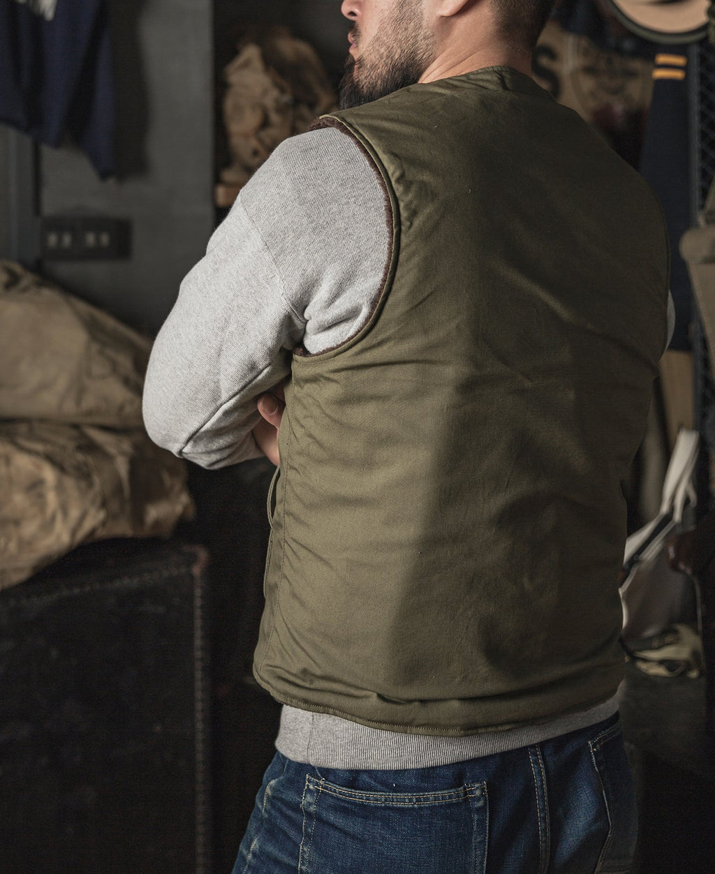 Gilet zippé doublé polaire olive avec grandes poches avant