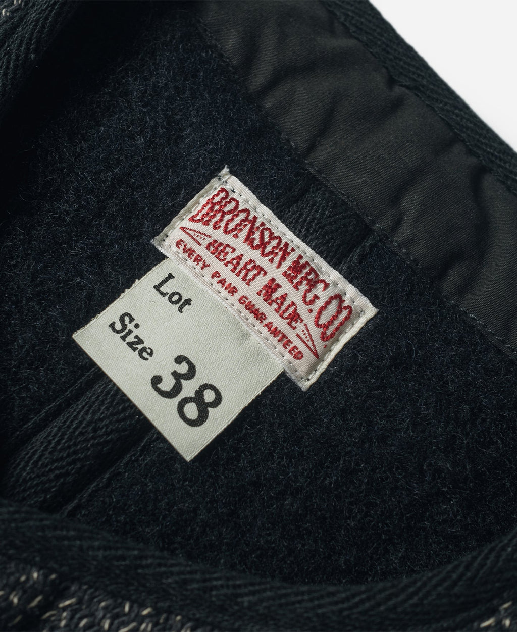 Gilet en laine mélangée poivre et sel à quatre poches avec liseré noir coupe classique