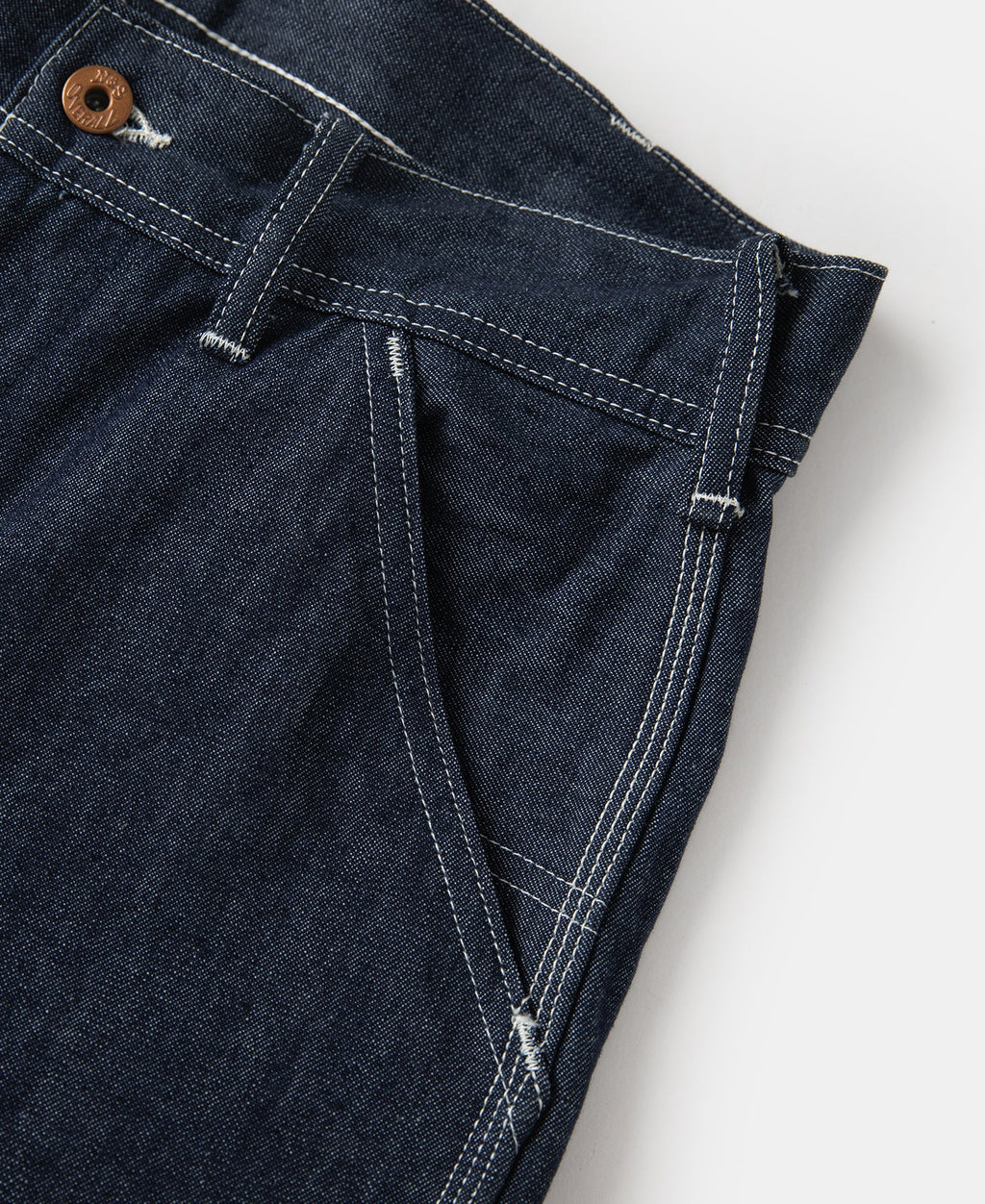 Jean toile indigo coupe large style peintre avec surpiqûres contrastantes